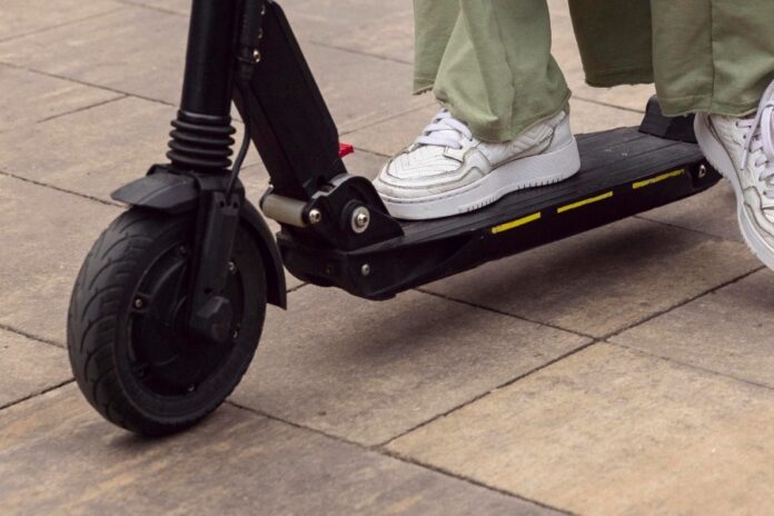 woman-riding-her-electric-scooter-outdoors.59b219